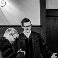 Black and white picture of 3 faculty chatting